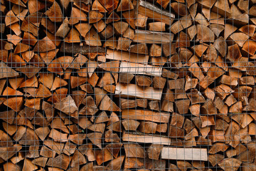 Wall Mural - Stacked firewood as background. Heating house in winter