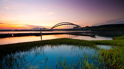 Wall Mural - Dam scenery during sunrise at putrajaya lake.