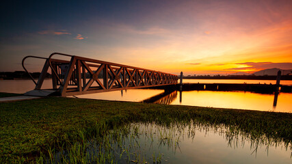 Wall Mural - Dam scenery during sunrise at putrajaya lake.