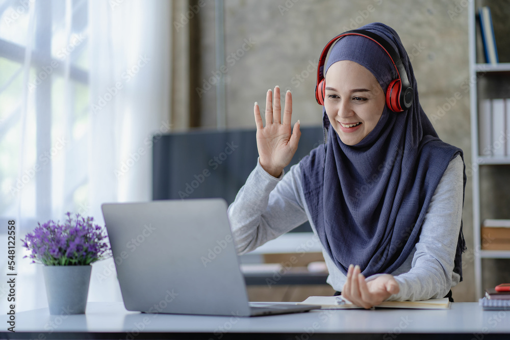 Muslim female student in hijab studying online with laptop Asian girl ...