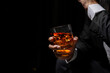 © maeching - Closeup businessmen holding a glass of whiskey