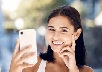 Canvas Print - Phone, selfie and portrait of a woman in a bathroom for skincare, beauty and cleaning against blurred background mockup. Face, girl and smile for picture after facial treatment, grooming and hygiene