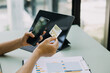 © ARMMY PICCA - Businessman hand using laptop compter with holding cradit card payments online shopping or business.