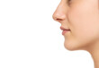 © vladimirfloyd - Closeup profile of female s nose and lips with no makeup on a white background
