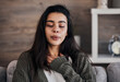 © L Ismail/peopleimages.com - Depression, sad and woman with eyes closed in home thinking of problems. Anxiety, mental health and unhappy, depressed and lonely female on sofa in living room trying to calm down and relax in house.