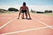 © L Ismail/peopleimages.com - Fitness, running and woman at start line training for marathon race event at stadium. Exercise, sports and motivation for winning, black woman runner from Jamaica ready to run with focus and energy.