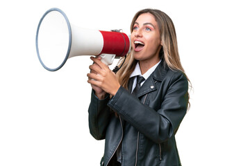 Canvas Print - Business pretty Uruguayan woman wearing a biker jacket over isolated background shouting through a megaphone