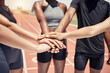 © L Ismail/peopleimages.com - Hands together diversity and runner motivation, support goal strategy and teamwork on stadium track. Team building, collaboration and training or workout, success and team fitness mindset outdoor