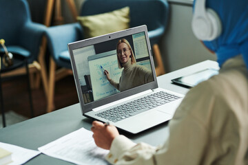 Poster - Confident blond teacher on laptop screen pointing at whiteboard while explaining new English grammar subject to online students