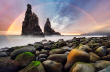 Rainbow Sunrise Rocky Coast With Monumental Rocky Cliff And Blurred Sea Water. Madeira Island, Portugal