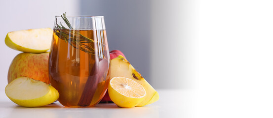 Wall Mural - Glass of fresh apple juice on light background with space for text