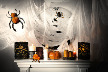 Poster - Different Halloween decor on fireplace indoors. Festive interior