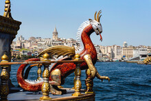 View Of Galata Tower And Golden Horn With A Dragon-prowed Boat In The Foreground. Selected Focus, Close-up. Istanbul, Turkey