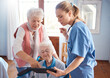 © David L/peopleimages.com - Doctor, tablet and visit for elderly care, consultation or healthcare diagnosis at old age home. Nurse or medical therapist working with touchscreen helping or consulting senior patient in wheelchair
