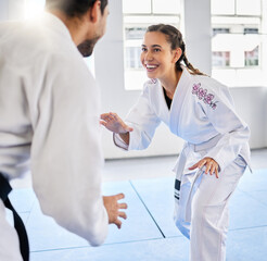 Wall Mural - Karate, fitness and teacher with student, combat sports and training for skill development, power and discipline in dojo gym. Fight, happy in taekwondo class and martial arts with sport exercise.