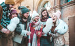 © Davide Angelini - Group of young people holding sparklers celebrating new year eve
