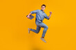 © Tetiana - Photo of cheerful caucasian smart young man holding laptop smiling jumping high running isolated shine background