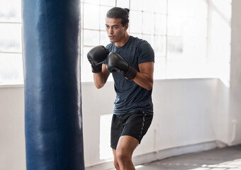 Poster - Man, boxing and training with punching bag in gym for body fitness, health and wellness with boxing gloves. Boxer, martial arts or exercise workout for sport, cardio or focus with precision in studio