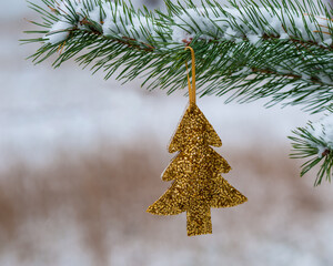 Wall Mural - Christmas decoration on the tree branch in the forest. Blur, soft focus