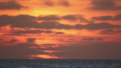 Wall Mural - Beautiful evening sunset with big Sun in the Atlantic Ocean at Portugal coast. 