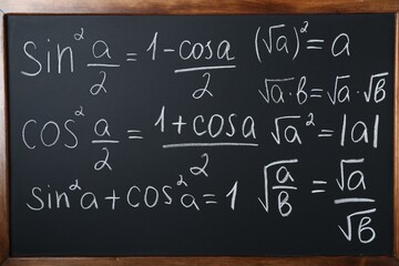 Wall Mural - Different mathematical formulas written with chalk on blackboard