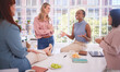 © Alexis S/peopleimages.com - Diversity, lunch and business women relax in an office building talking, gossip or share news after meeting. Team building, black woman and friends speaking enjoying a conversation together on break