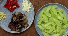 Ingredients For Stir Fry Celtuce (stem Lettuce) With Wood Ear Mushrooms (mun) Dish. Chinese Cuisine. Table Spin.