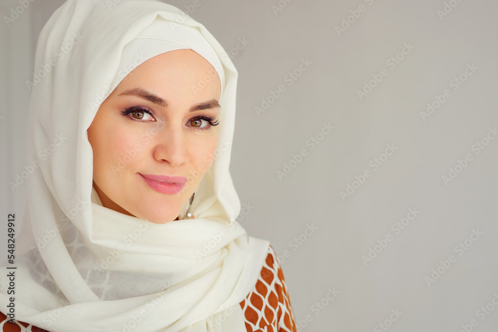 Portrait of beautiful young muslim arabian woman wearing white hijab ...