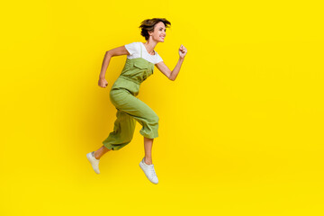 Sticker - Profile body size photo of youngster playful girl fast runner empty space jump air deadline for weekend empty space isolated on yellow color background