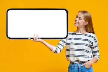 Poster - Online Offer. Beautiful Young Woman Holding Huge Smartphone With Blank White Screen