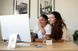 © Brett Edwards/Adobe Stock - Adult lesbian couple use desktop computer in home office