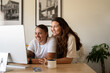 © Brett Edwards/Adobe Stock - Adult lesbian couple use desktop computer in home office