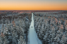 Country Forest Road In Winter Time With Lonely Car From Above