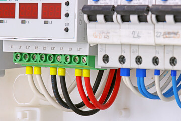 Connection of automatic current switches to protect the electrical wires in the control panel.Soft focus.