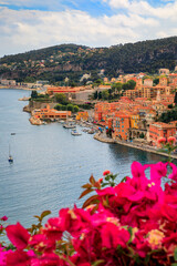 Wall Mural - Villefranche sur Mer medieval town in South of France with bougainvillea blossom