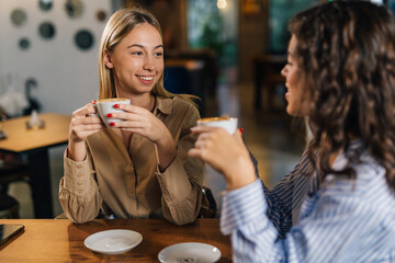 Wall Mural - Two friends have coffee together