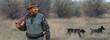 © Mountains Hunter - Hunter man in camouflage with a gun during the hunt in search of wild birds or game.