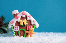 Christmas Festive Greeting Card, Mock Up, Ginger Bread House Ornament, Snow On Blue Background With Copy Space.