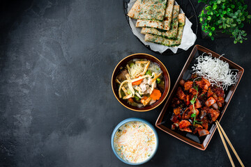 Wall Mural - Asian food set pork with shiitake mushrooms and vegetables, creamy soup with salmon, chicken noodle soup with mushrooms, Indian cheese and spinach tortillas.