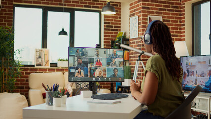 Poster - Female freelancer attending business meeting on videocall with webcam, using computer to talk to people on online teleconference call. Young adult chatting on remote videoconference, work from home.