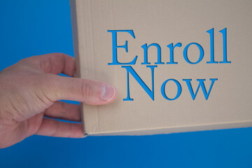 Poster - Enroll Now word with cardboard box. Brown folded card box.