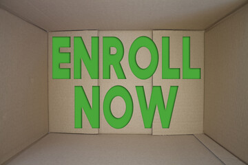 Poster - Enroll Now word with cardboard box. Brown folded card box.