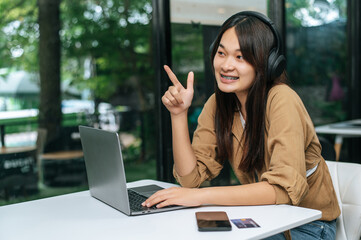 Wall Mural - Young woman enjoy to listening music on headphone