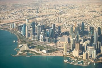 Wall Mural - Aerial view of Doha skyline from airplane. Corniche and modern buildings, Qatar