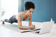 © Rene L/peopleimages.com - Wellness, fitness and yoga webinar on laptop for healthy and young black woman in body plank position. Focus, balance and online mindfulness in exercise class with girl on floor in home for health.