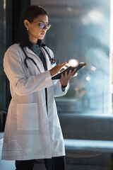 Poster - Doctor, tablet and woman planning at night in medical office, hospital and clinic for research, test results information and connection. Focus healthcare worker, telehealth and digital app technology