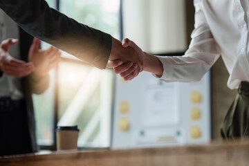 Wall Mural - Business partnership meeting concept. Image businessmans handshake. Successful businessmen handshaking after good deal. Group support concept