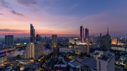 Wall Mural - Sunset over illuminated landmark building in downtown and cruise ship on Chao Phraya riverside in Bangkok