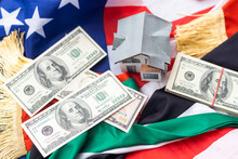 Financial Concept With Banknotes Of US Currency Around National Flag Of United Arab Emirates And USA Flag