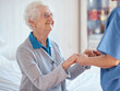 © David L/peopleimages.com - Elderly woman, nurse holding hands and nursing home support with medical professional exam, retirement healthcare and retired lady. Senior rehabilitation center, hospital worker and consulting doctor